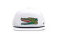 A white structured snapback Bajio cap featuring a colorful embroidered alligator patch on the front panel and a black rope, shown against a plain white background.