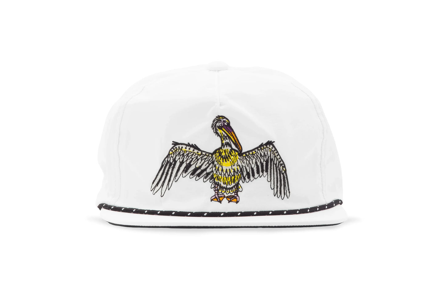A white structured Bajio baseball cap featuring an embroidered brown pelican with outstretched wings on the front, and a black rope trim along the edge of the flat brim.