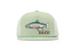A light sage green trucker hat with a mesh back, featuring an embroidered rainbow trout and the word 'BAJIO' on the front panel, with a green and white striped rope detail along the brim.