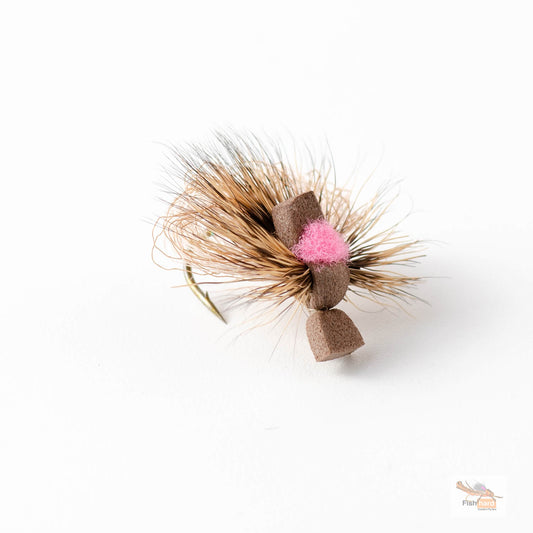 A small fishing fly lure with tan and brown hackle feathers, a brown body, and brown foam on a white background.